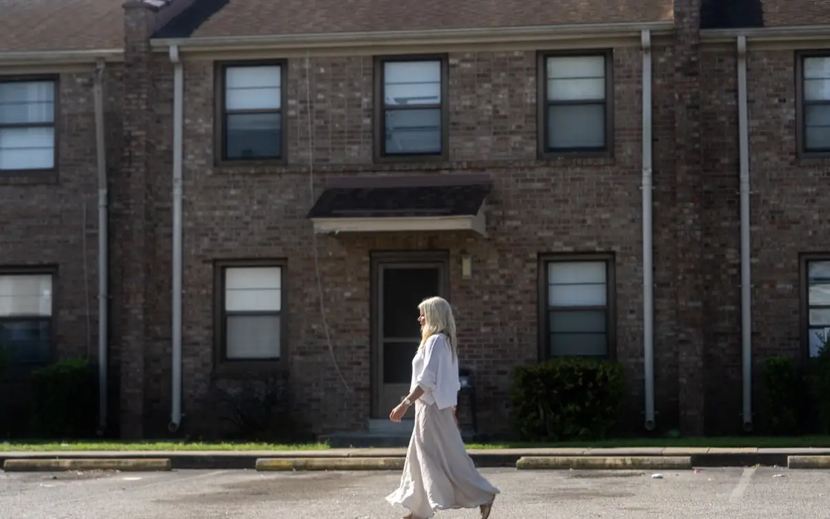 Sara walking through a neighborhood connected to her childhood
